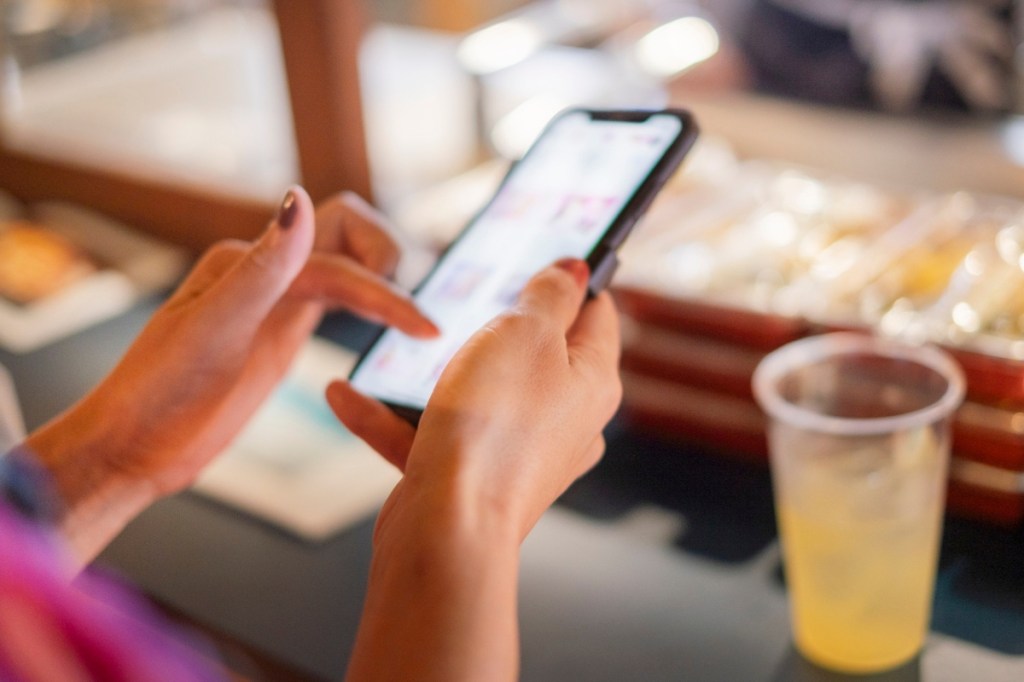 Image of scrolling on phone, mindful social media, doomscrolling